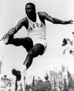 Robinson competing in the long jump for UCLA, 1945