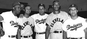 Jackie Robinson, Larry Doby, Don Newcombe, Luke Easter and Roy Campanella posing for a photo as professional Baseball players