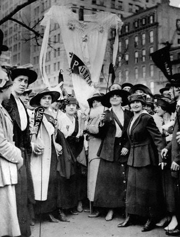 ca. 1916, Manhattan, New York, New York, USA --- Female garment workers striking on May Day fashion a neglige as a banner. ca. 1916, New York City. --- Image by © CORBIS