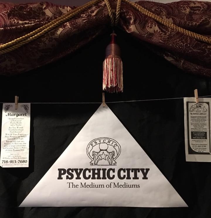 Exhibit logo for Psychic City: The Medium of Mediums with crystal ball