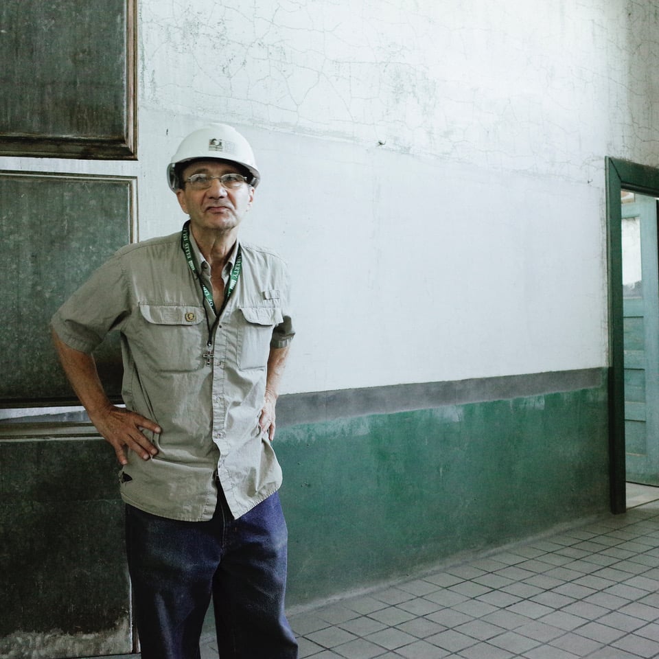 Man in hard hat with hands on hips